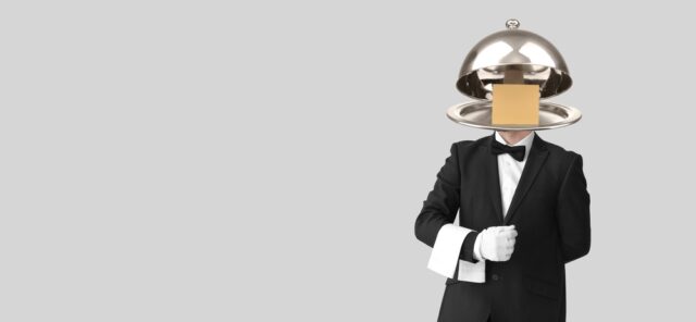 Waiter,With,Tray,Instead,Of,His,Head,On,Grey,Background. gajes